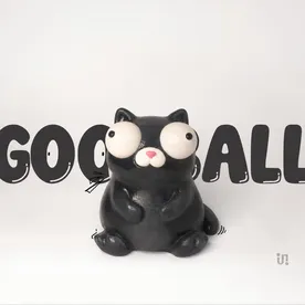 Goofball, a black hand-painted cat figure with oversized googly eyes.